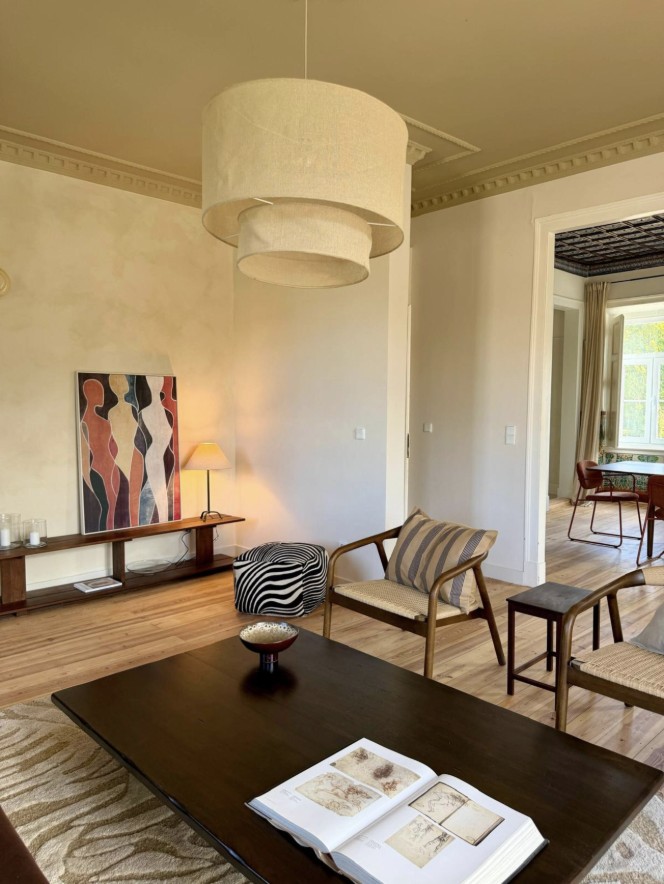 Sitting room with linen lanterns, art and low wooden table